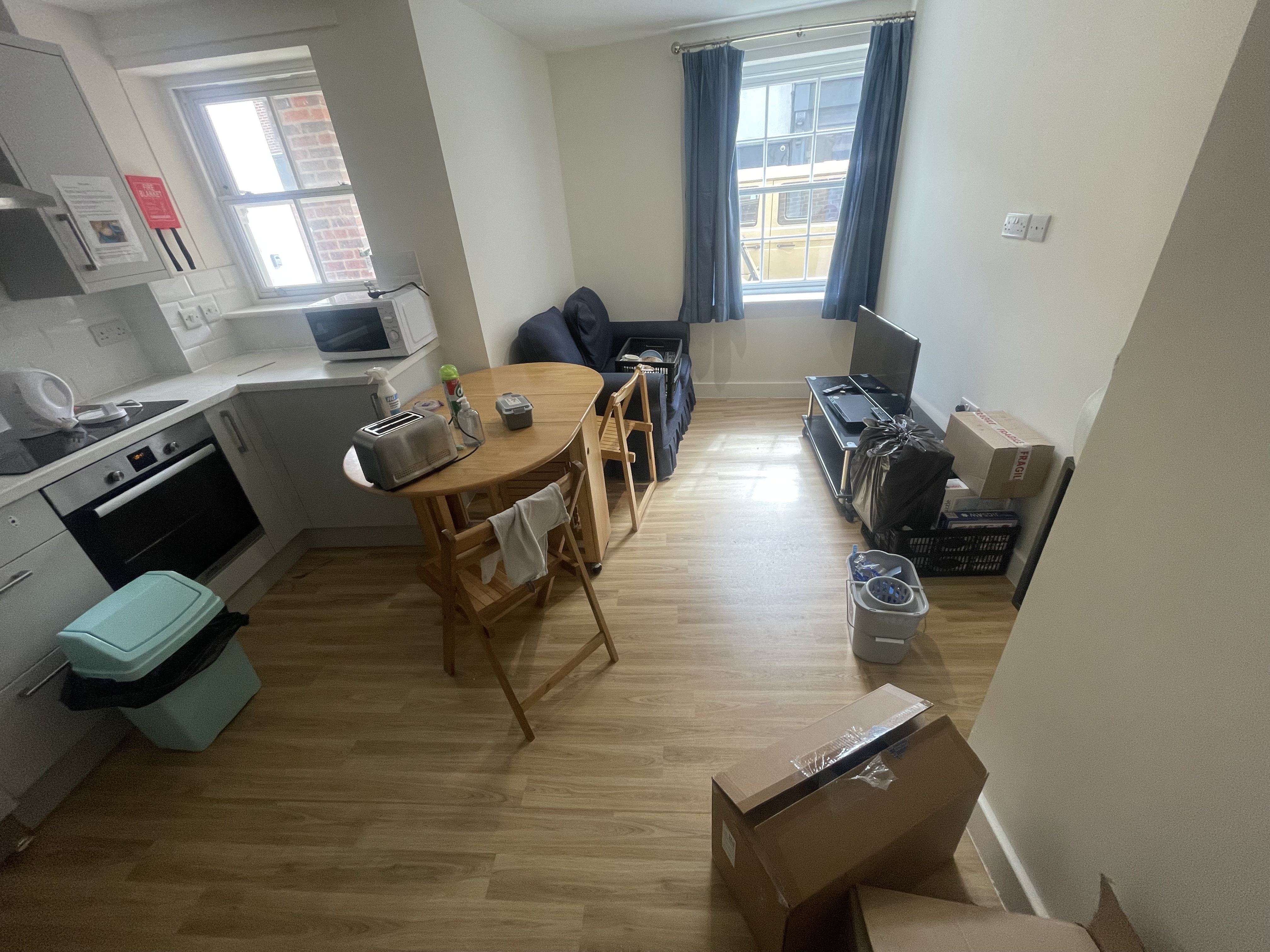A clean and empty living room after an end-of-tenancy house clearance in Portsmouth.