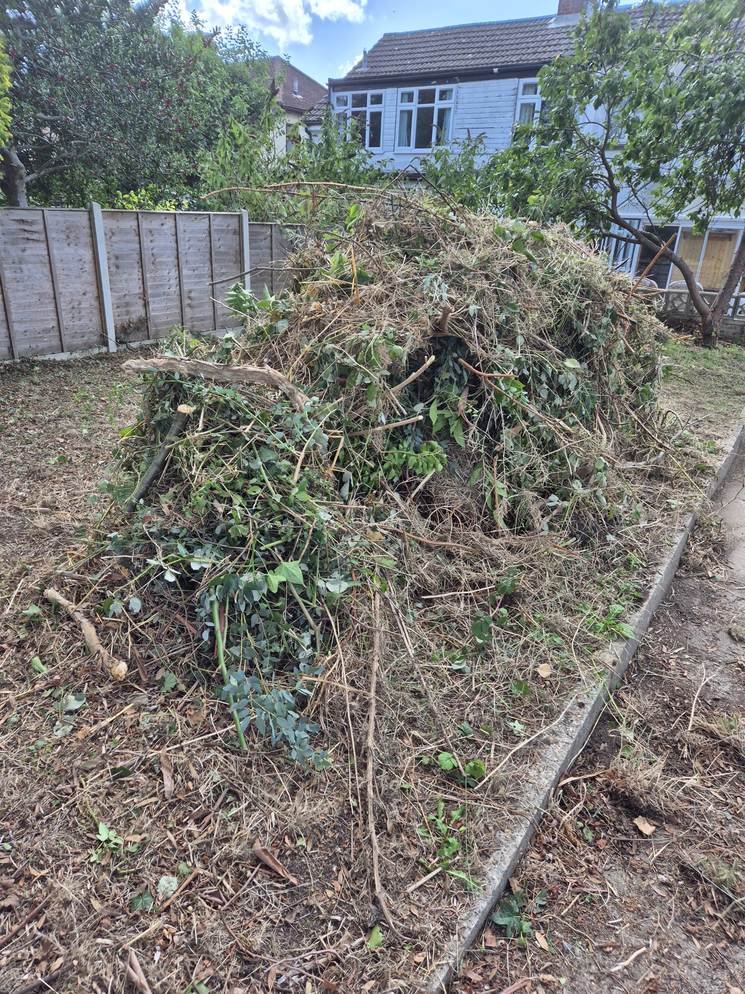 A tidy garden and empty garage in Havant after a professional waste clearance by Hampshire Waste Clearance Services.
