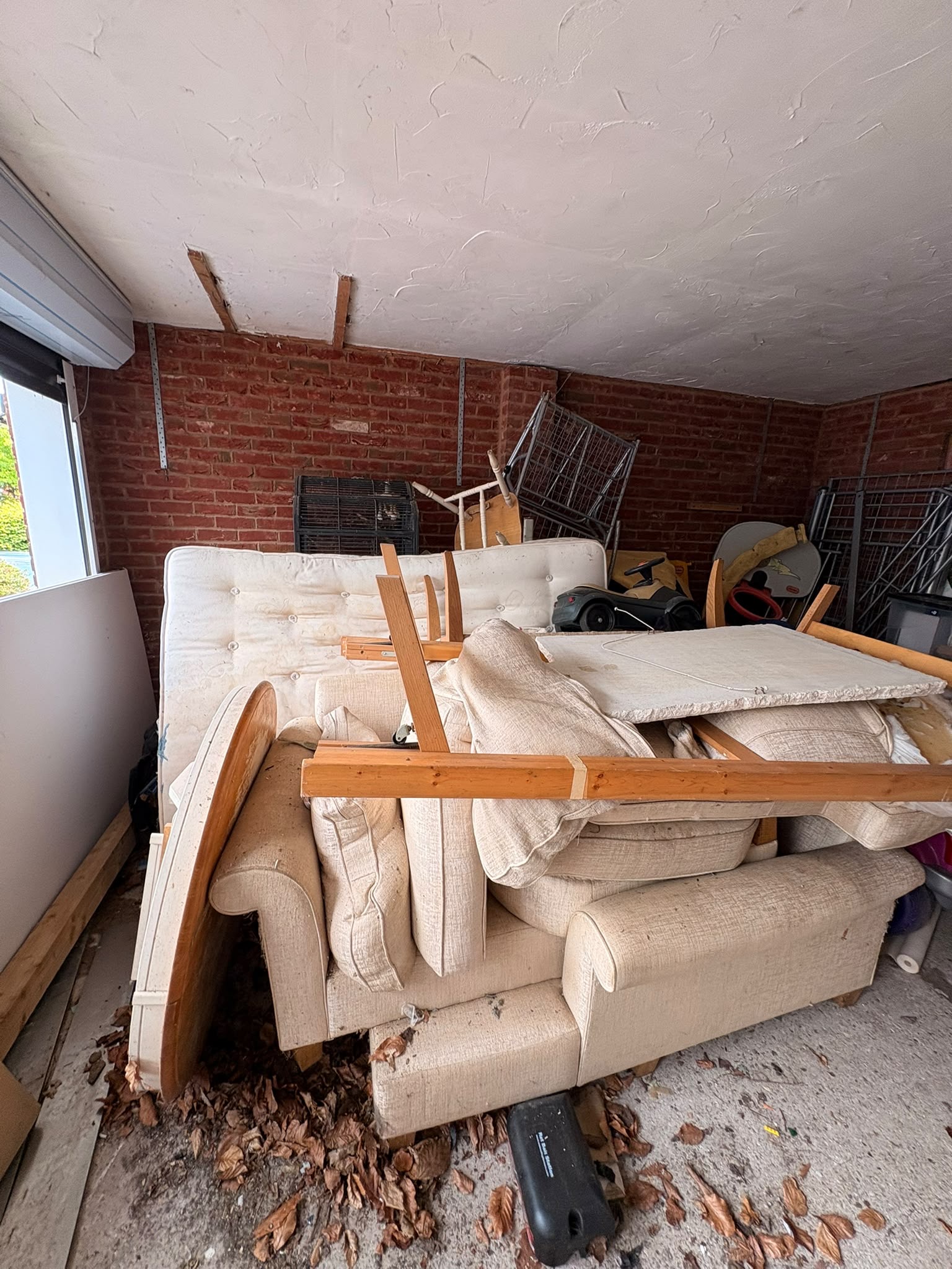 A large pile of household waste and old furniture cleared from a property in Emsworth.